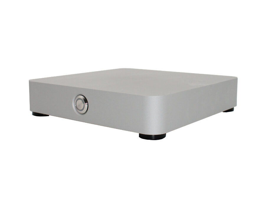 Silver rectangular audio amplifier with a round front knob and small feet, positioned on a white background.